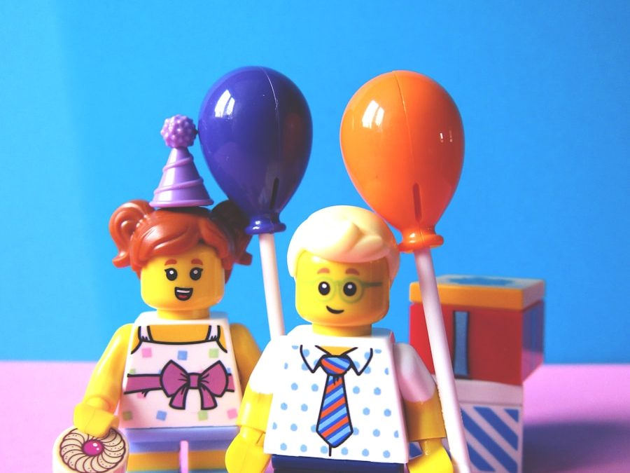 girl and boy holding balloon Lego minifugures