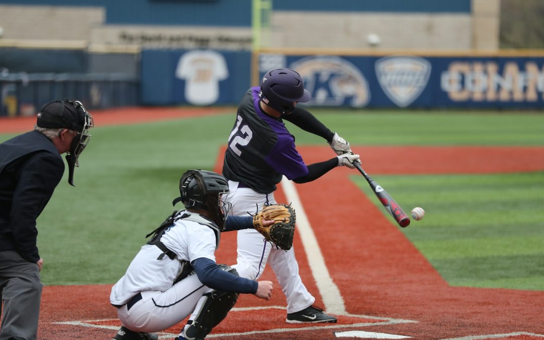 baseball player swinging bat