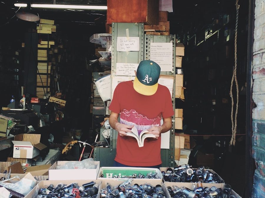 man standing beside boxes