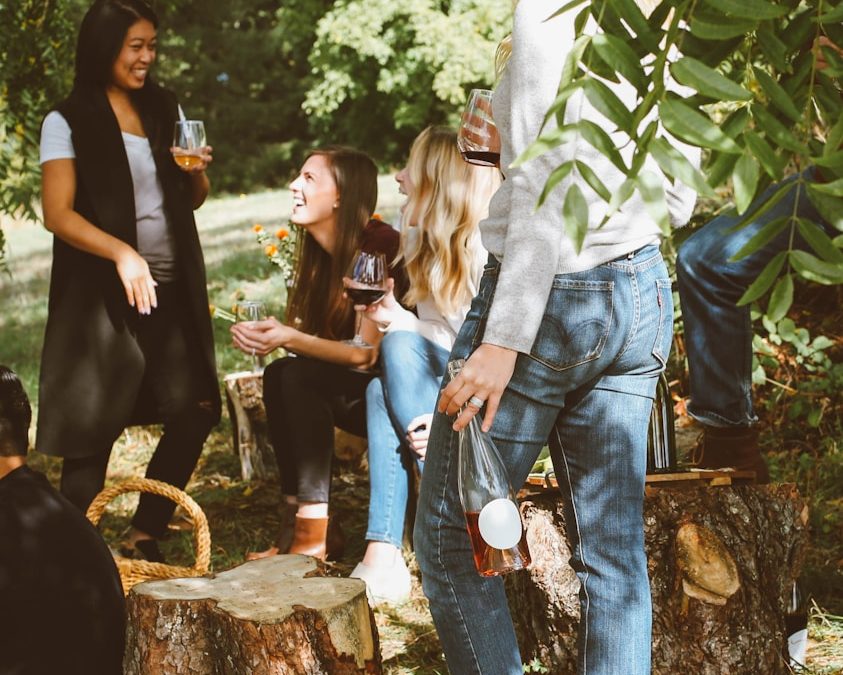 group of women in forest drinking